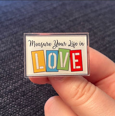 Rent “Measure Your Life in Love” – Acrylic PIN (1.5